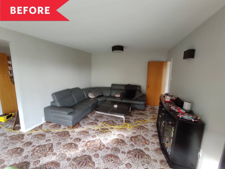 Living room with gray sectional sofa, patterned carpet, dark cabinet with toy cars, and a "Before" label in the corner.