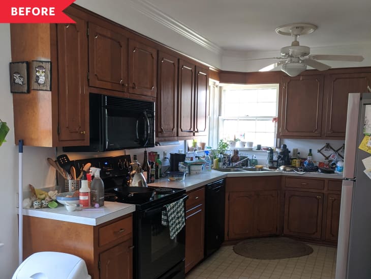 Before: dark wood kitchen with beige floors