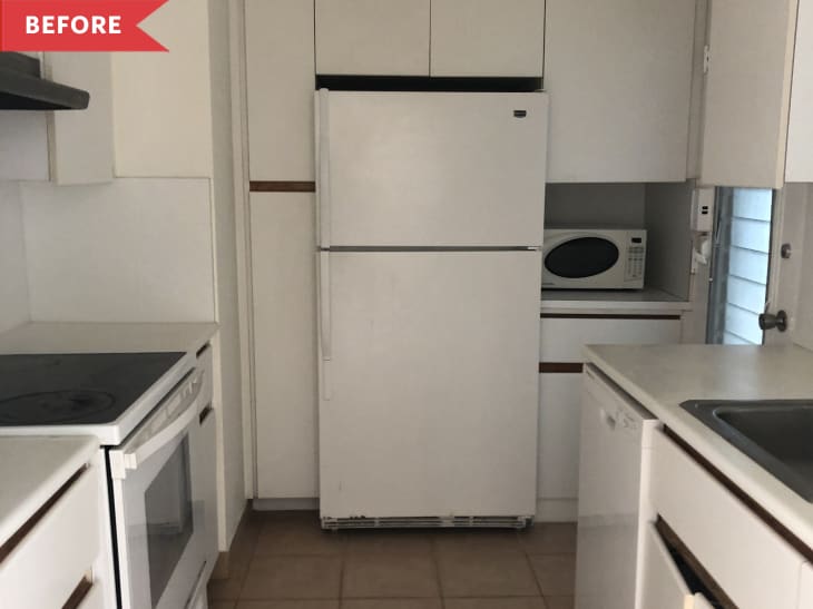 Before: Kitchen with white cabinets and appliances
