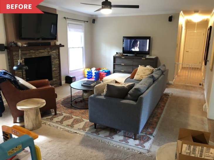 Before: Living room with baby toys and two TVs