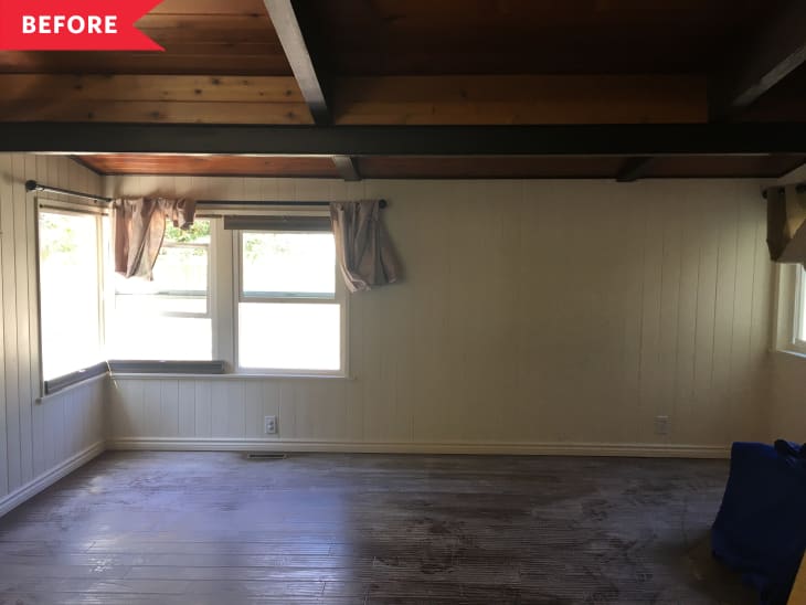 Before: Empty room with open ceilings and off-white shiplap on walls