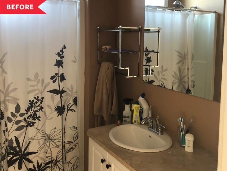 Before: brown bathroom with brown and white vanity and plain mirror