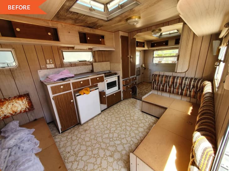 Before: Interior of RV with brown walls, cabinets, and booth