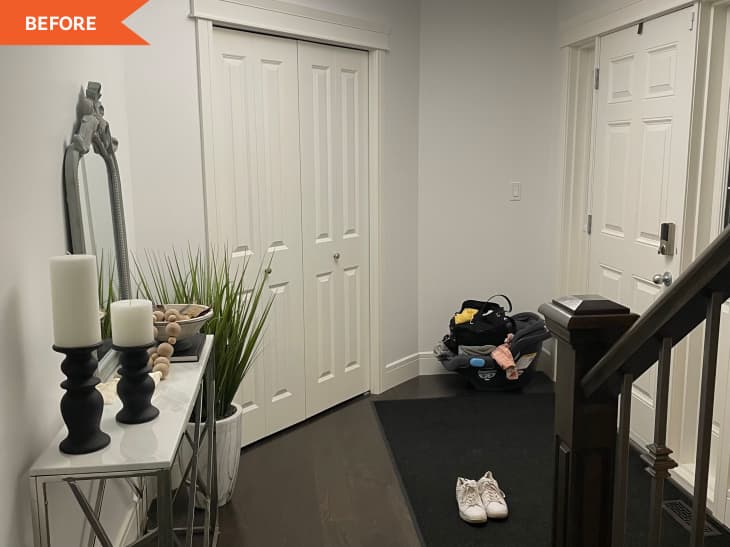 Before: an entryway with white closet doors