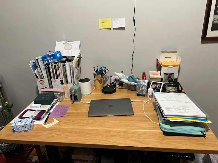 Laptop on desk of home office.