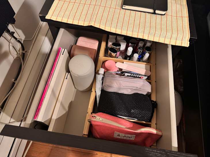 Toiletries organized in drawer.