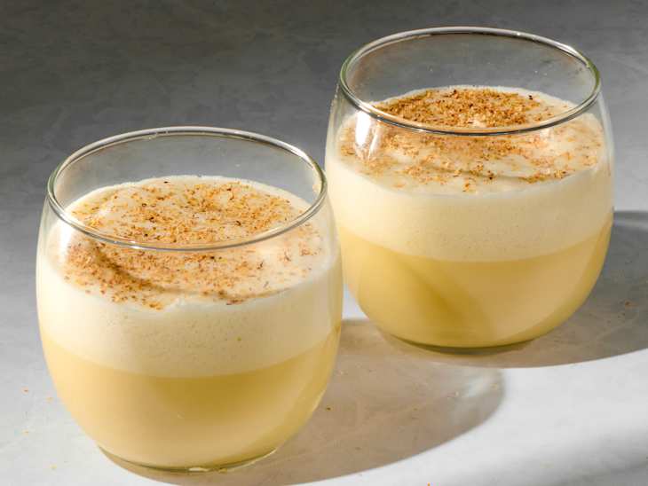 angled shot of two glasses of eggnog