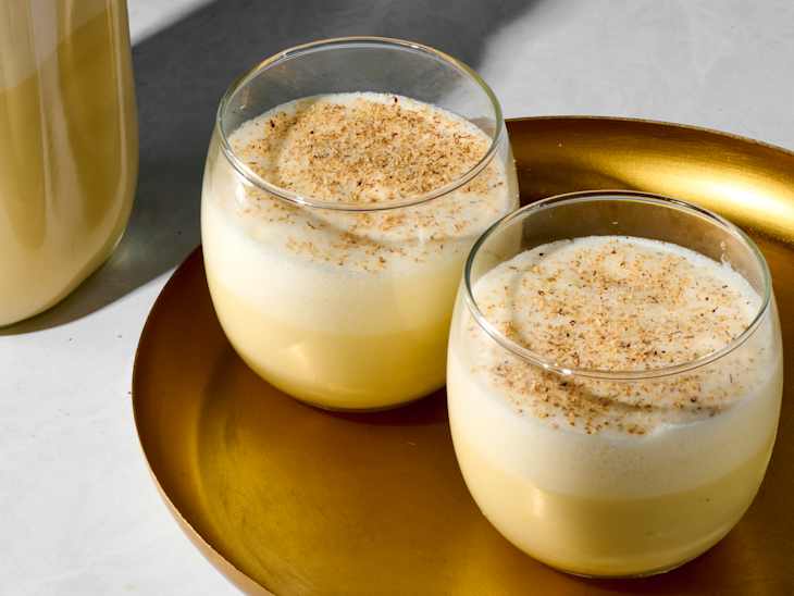 angled shot of two glasses of eggnog