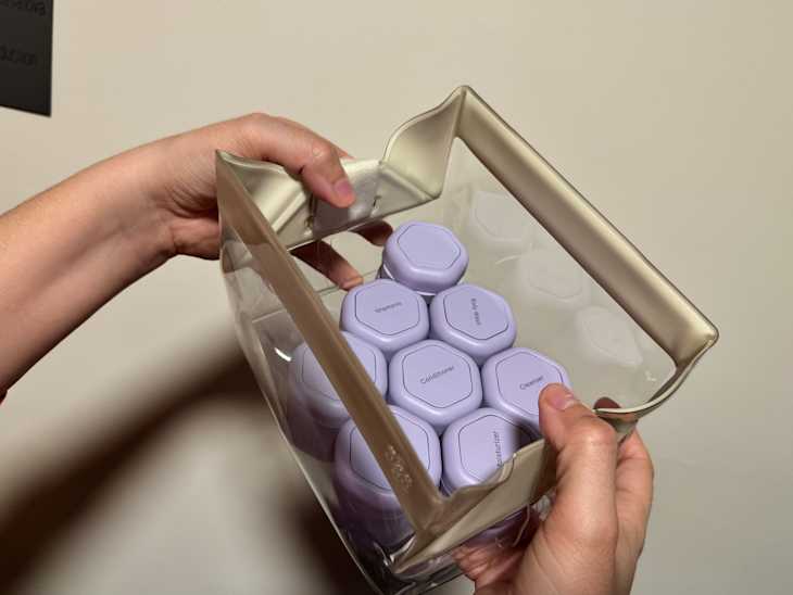 Someone holding cadence travel set.