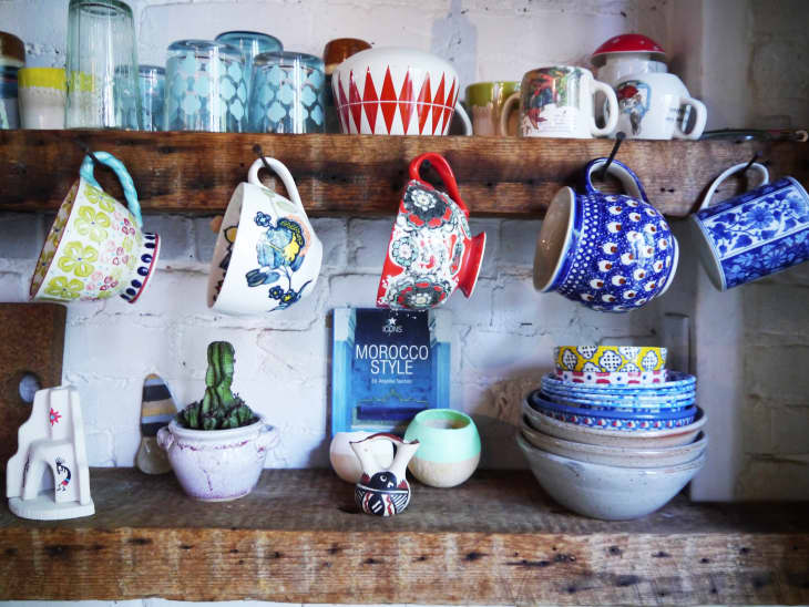 wooden shelves and patterned dishware