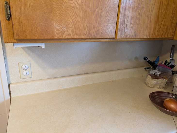 Kitchen cabinets before adding towel bar.