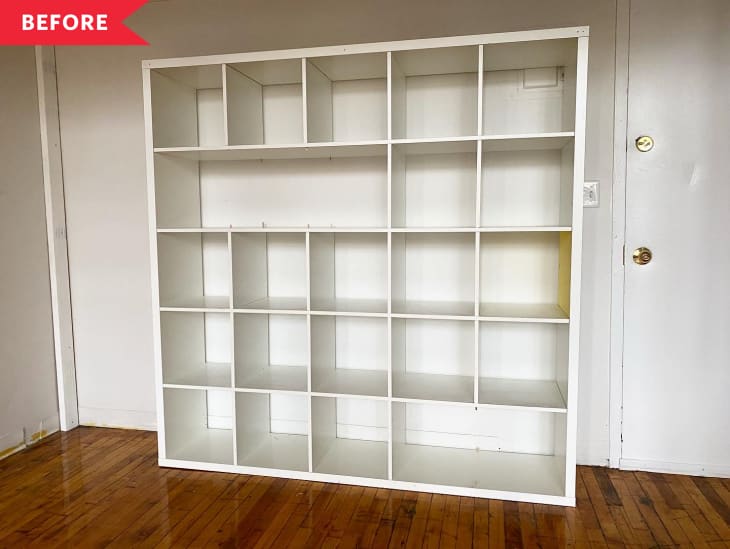 Before: Empty white IKEA KALLAX 5-by-5 cube shelf