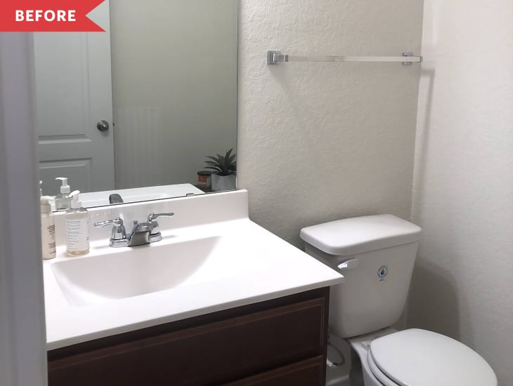 Before: bathroom with white walls and dark wood vanity
