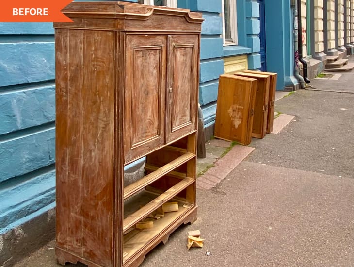 Before: An old armoire outside of a blue home