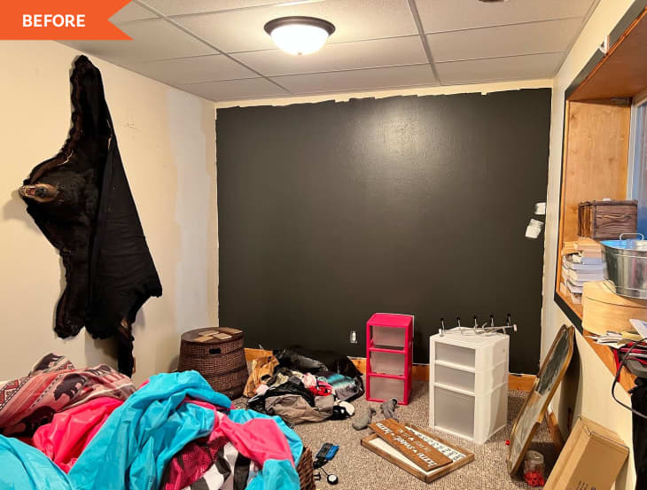 Before: A room with a bear skin on the wall and containers and various objects on the floor