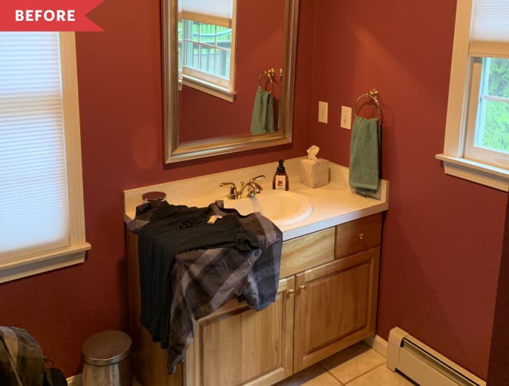 Before: bathroom painted red with natural wood vanity