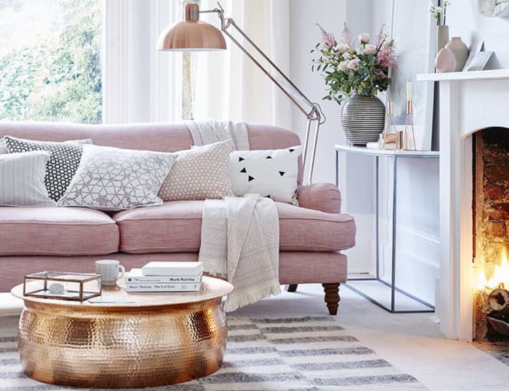 Blush pink accent sofa with gold elements
