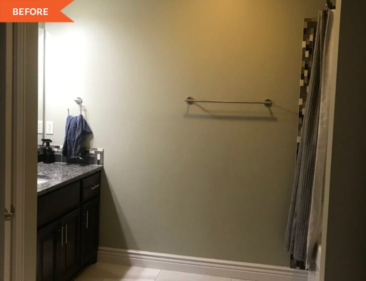 Before: Bathroom with green walls and sheet mirror