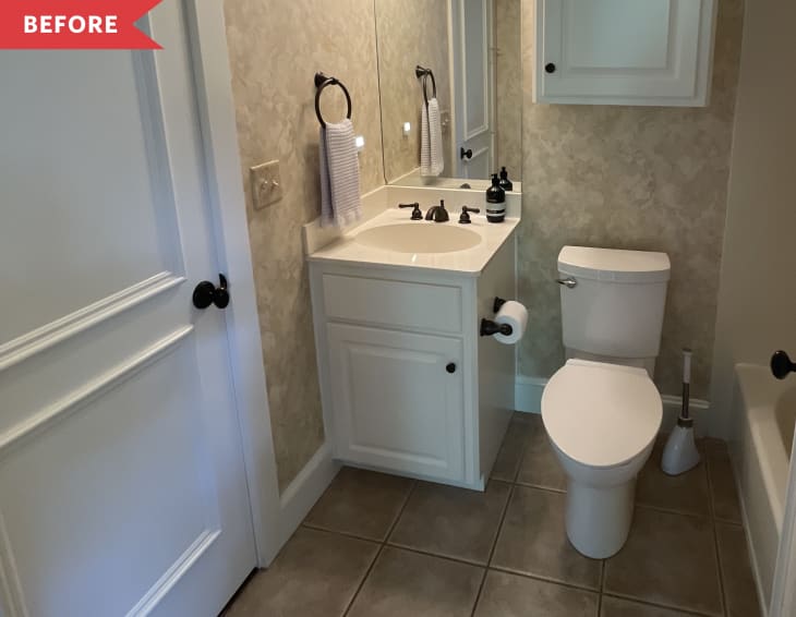 Before: Beige bathroom with sponge-painted walls and dated light fixture above basic sheet mirror