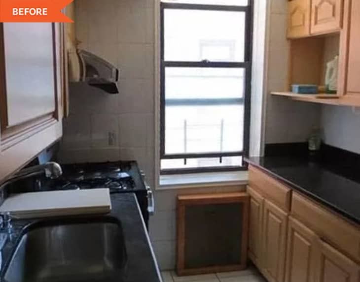 Before: kitchen with counters on either side with brown cabinets