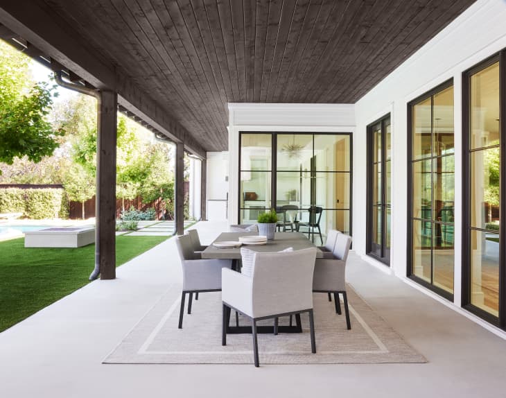 patio with overhang painted with Behr exterior stain color Cordovan Brown