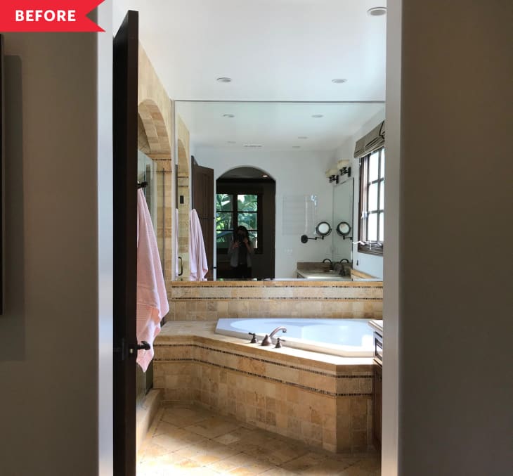 Before: bathroom with dated tan floors and giant built-in tub