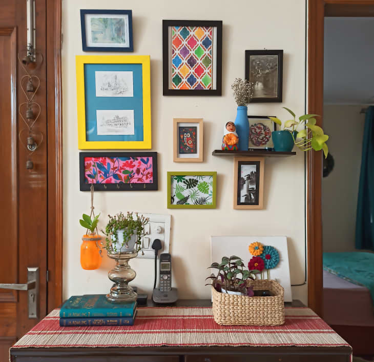 gallery wall with frames painted different colors
