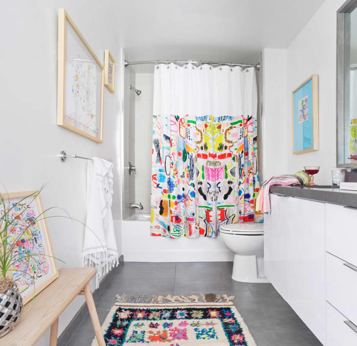 Bathroom with colorful rug and shower curtain
