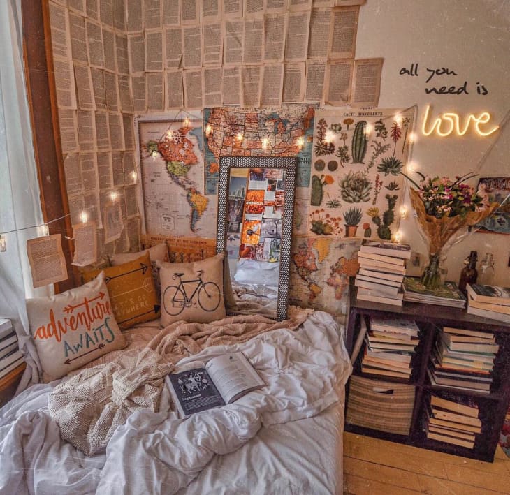 day bed with string lights, surrounded by bookshelves