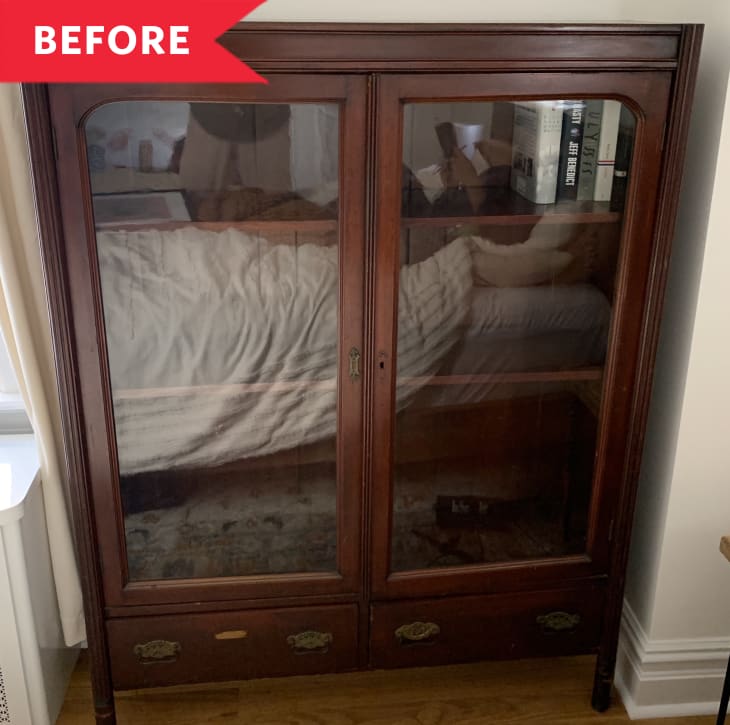 Before: Dark wood glass-front cabinet