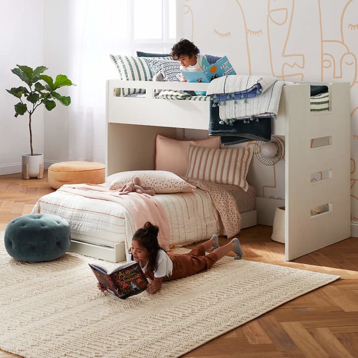 two kids reading in a low toddler bunk bed from crate &amp; kids