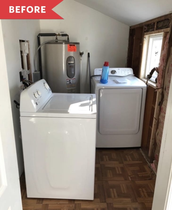 Small laundry room with a washing machine, dryer, water heater, and detergent bottle on a wooden floor.