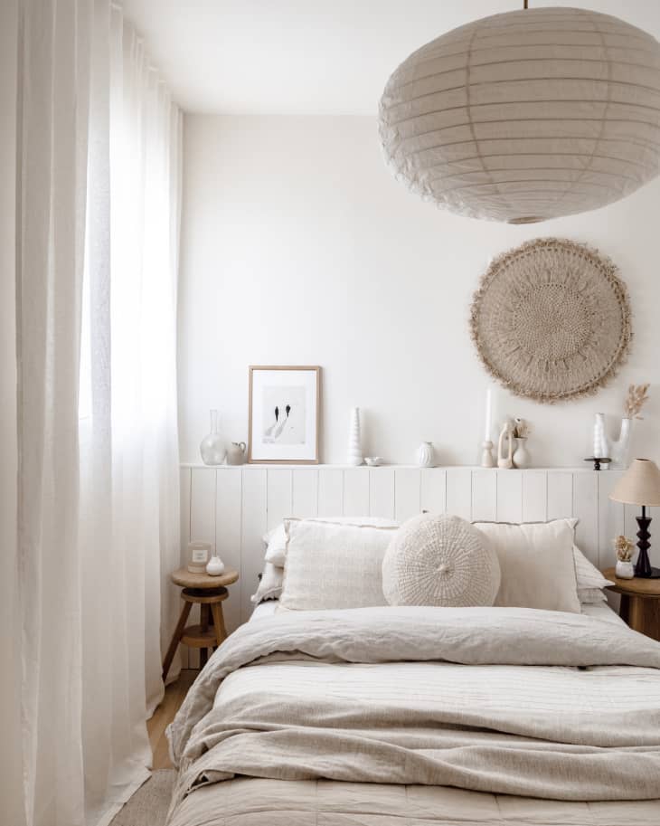 Apartment bedroom with lots of white, natural wood, natural colors, natural fiber textiles