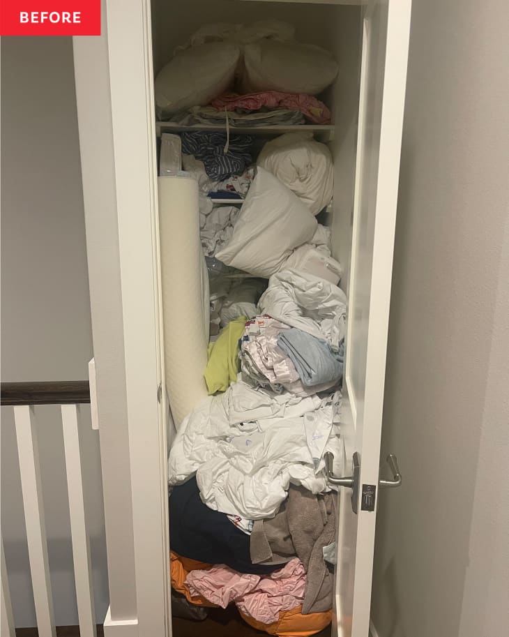 Linen closet before organizing: linens, sheets, pillows, towels, etc all shoved into a closet