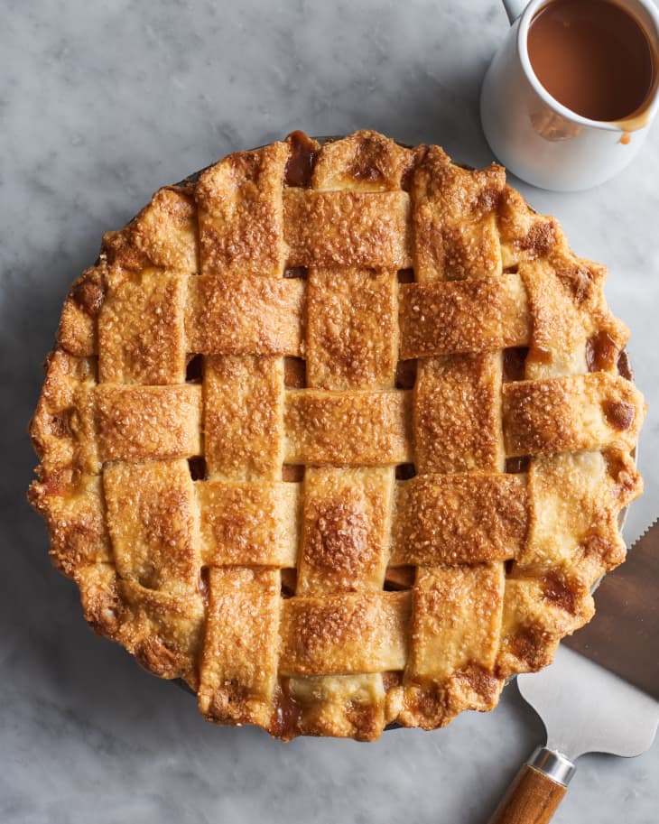 salted caramel apple pie in a pie dish on a table