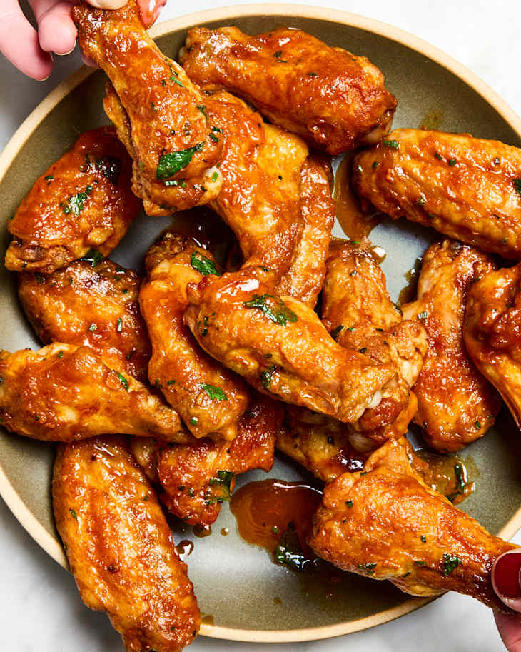 cowboy butter wings being picked up