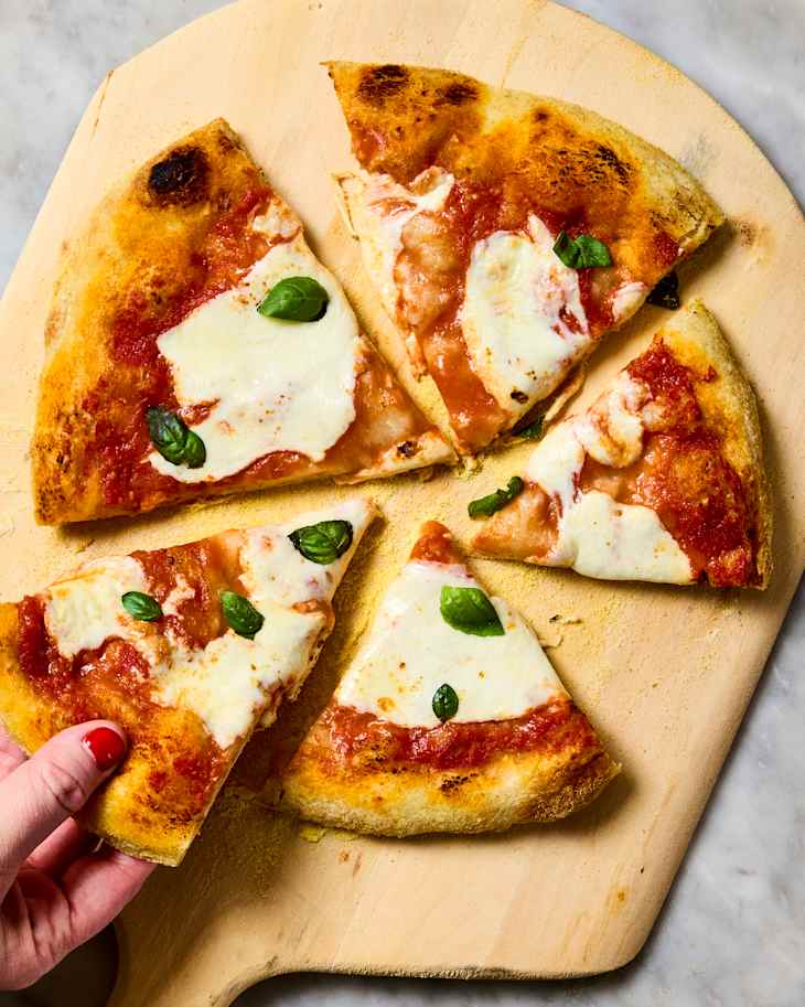 margherita pizza on a pizza peel