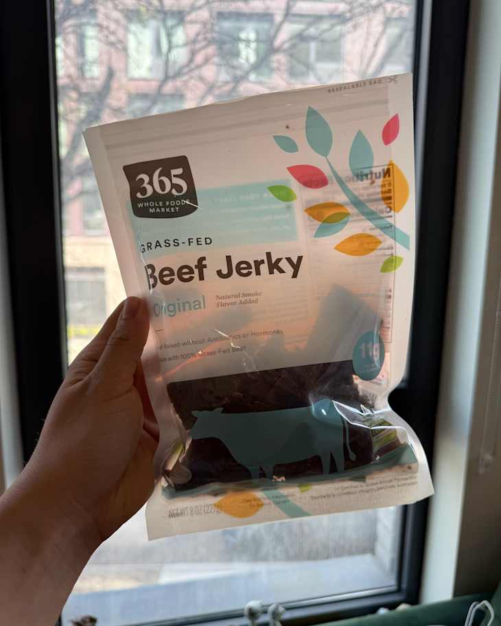 Someone holding package of 365 brand Beef Jerky.