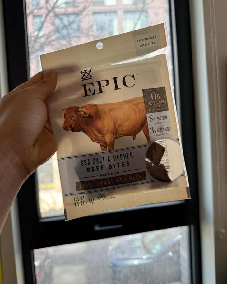 Someone holding package of Epic beef .