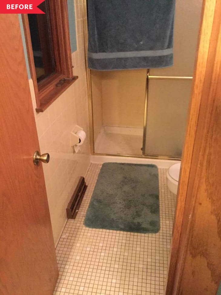 Before: gray bathroom with beige tile and wood vanity