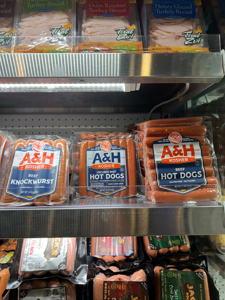 A&amp;H beef hot dogs in refrigerated section of grocery market.