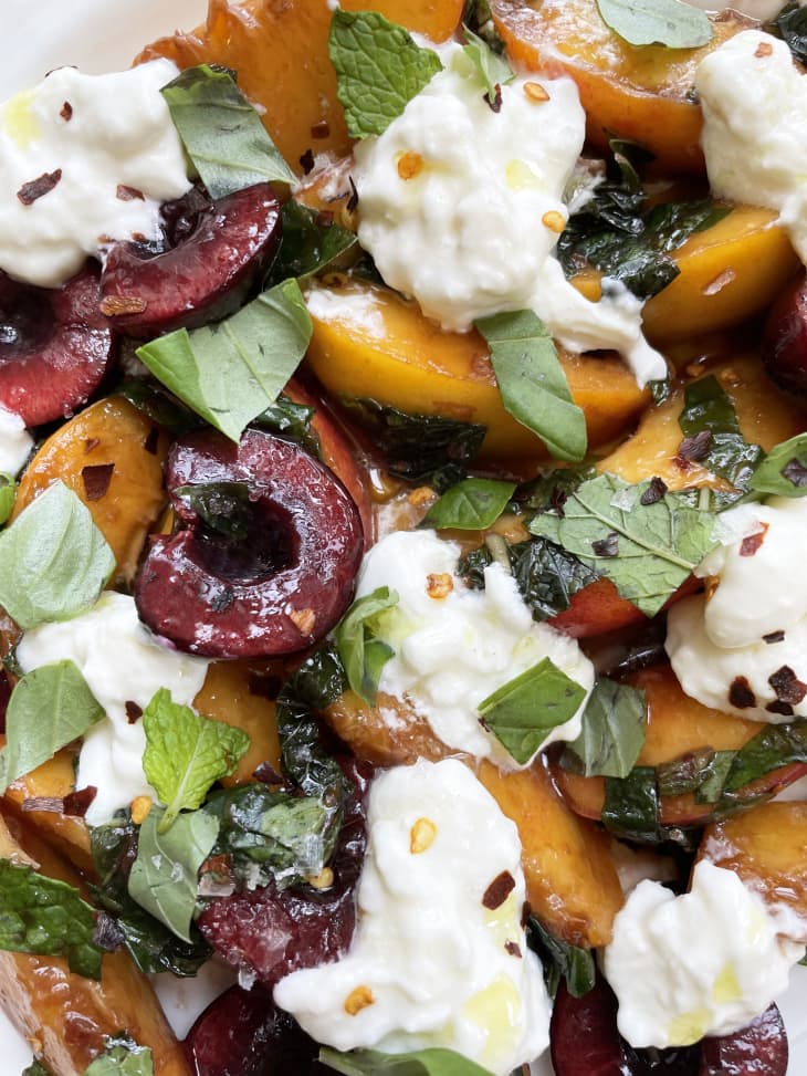 Close up of peach, cherry and burrata salad.