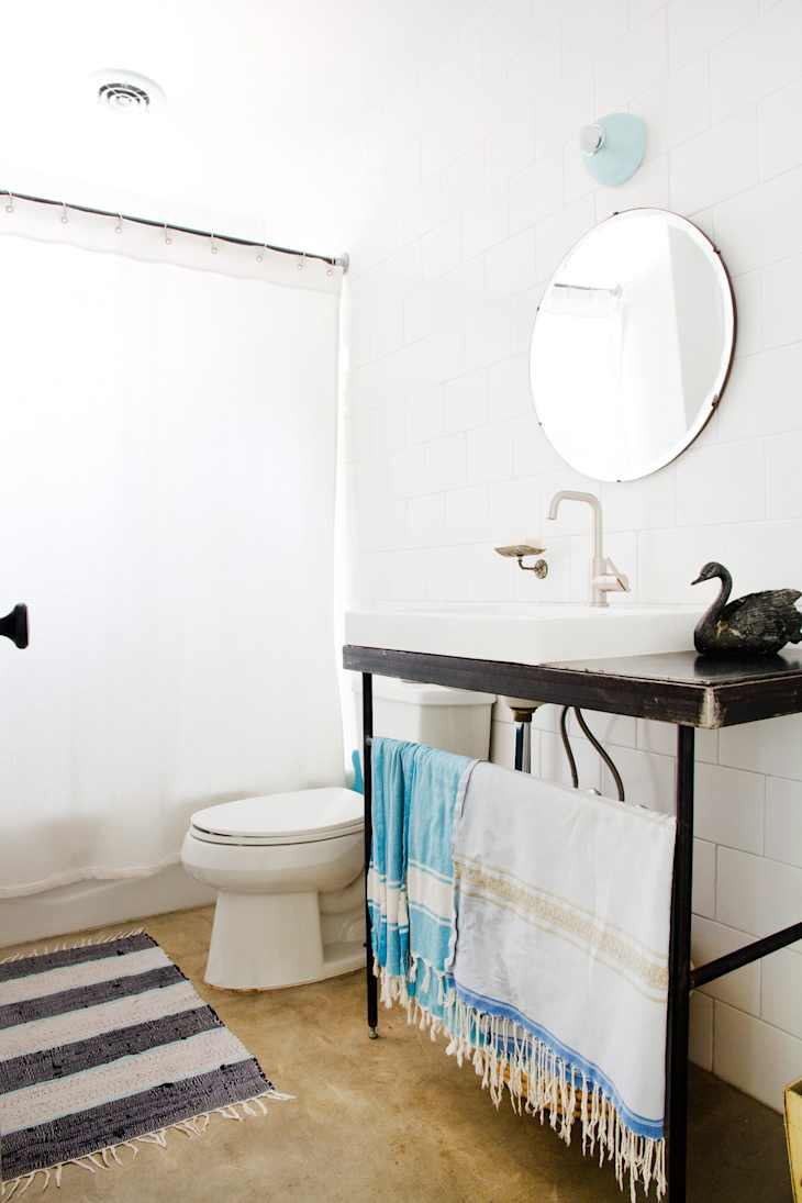 a clean, fresh, sparkling modern styled bathroom cleaned with homemade natural bathroom cleaners