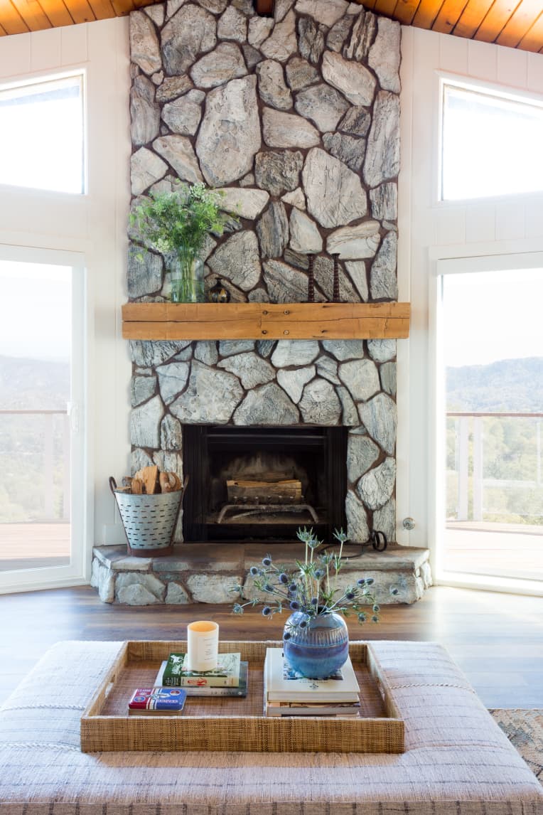 Unexpected storage in a living room for firewood and matches