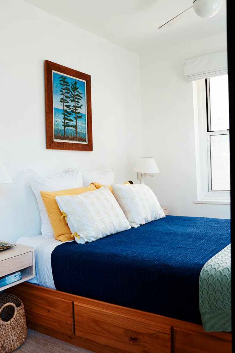 Bed with drawers underneath it in Laura Fenton's home