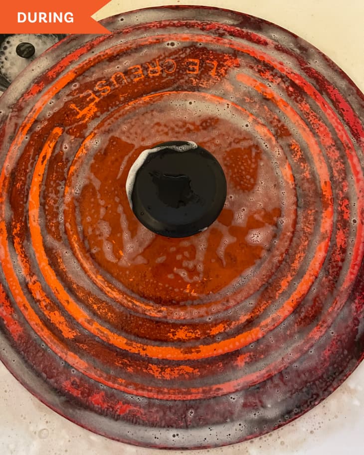 Le Creuset being cleaned
