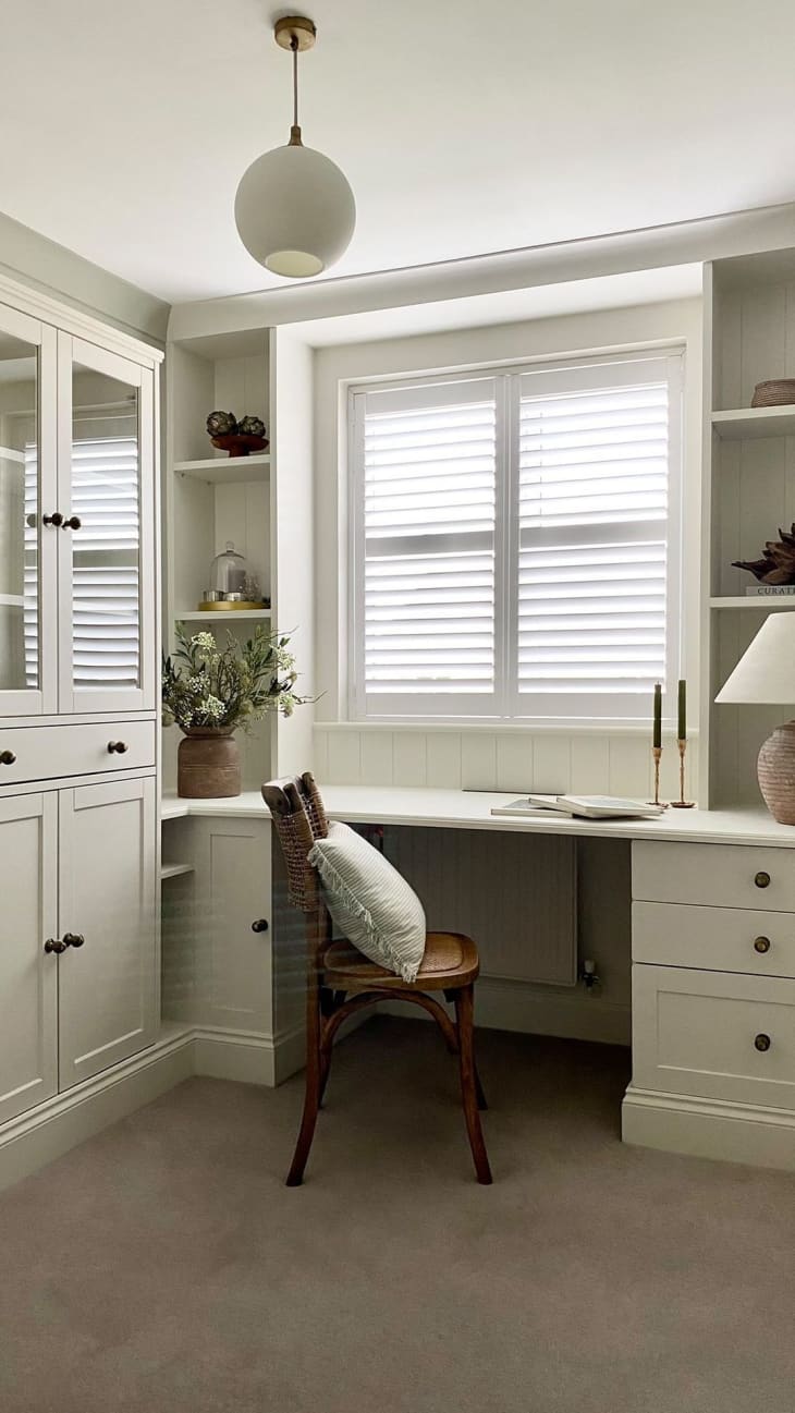 a white home office features IKEA desk and cabinet
