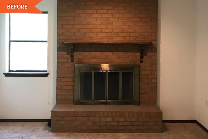"Before" photo of brick fireplace in empty room, window to the left