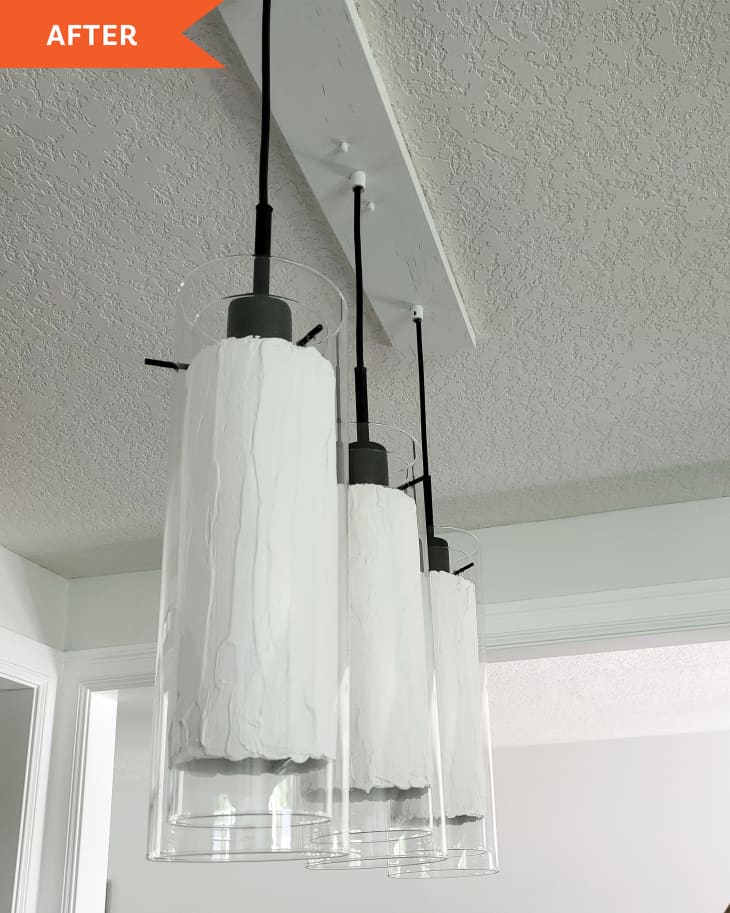 After photo of 3 DIYed glass pendant lights in a white kitchen