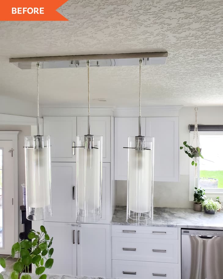 Before photo of 3 glass pendant lights in a white kitchen